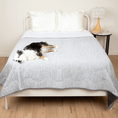Cargar la imagen en la vista de la galería, PupChill Cooling Waterproof Blanket Arctic Grey by Paw.com on a bed with a lounging dog and a white bedside lamp.
