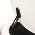 Load image into Gallery viewer, Beige fabric chair with black metal frame and coil springs, underside view.