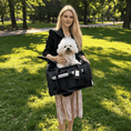 Bild in Galerie-Betrachter laden, Mr. Peanut's Gold Series expandable pet carrier in black fabric with mesh panels, dog inside.