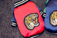 Bild in Galerie-Betrachter laden, Dog jackets: two red and blue bomber-style jackets with tiger head embroidery.
