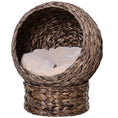 Cargar la imagen en la vista de la galería, Angled front view of The Cresselle Elevated Cat Bed in Dark Brown, with an open woven shell and light tufted cushion.
