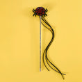 Cargar la imagen en la vista de la galería, Pet Zen Halloween teaser stick with plush black spider, red web, purple eyes, and tassel cords on a glitter wand.