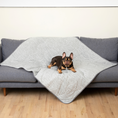 Bild in Galerie-Betrachter laden, PupChill cooling waterproof blanket Arctic Grey on a gray quilted sofa, with a small dog comfortably resting.