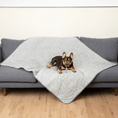 Cargar la imagen en la vista de la galería, PupChill cooling waterproof blanket Arctic Grey on a gray quilted sofa, with a small dog comfortably resting.