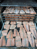 Carica l'immagine nel visualizzatore della galleria, Salmon fillet portions on metal racks in a smoker, Naked Beasts