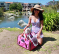 Bild in Galerie-Betrachter laden, Mr. Peanut's Gold Series V2.0 Pet Carrier, pink, air-travel approved, with small dog inside.