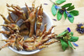 Load image into Gallery viewer, Chicken feet, Naked Beasts brand, golden-brown, several arranged in a white bowl.