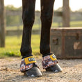 Load image into Gallery viewer, Jeffers Expression No-Turn Bell Boots for Horses, nylon pair with yellow straps on colorful patterned fabric