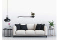 Load image into Gallery viewer, Cat Plant Stand for Wall by Catastrophic Creations; black wall-mounted cat shelf with small planter.