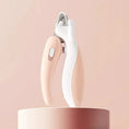 Load image into Gallery viewer, Whisker House professional pet nail clippers with LED light, pink and white handles.