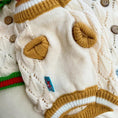 Load image into Gallery viewer, Hollow-out knitted dog sweater by Pet Zen in cream with brown heart patches and striped trim.