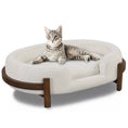Load image into Gallery viewer, Calming Dog Bed Durable Fabric Pet Furniture by Home Furnishers; round beige fabric bed with wood base, cat resting.