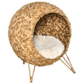 Load image into Gallery viewer, Cozy elevated cat bed, handcrafted woven brown wicker condo with soft beige cushion