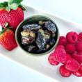 Load image into Gallery viewer, Chicken Hearts small animal treats in a green bowl; dark dried chunks with fresh strawberries and raspberries nearby.