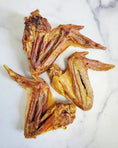 Load image into Gallery viewer, Turkey wings by Naked Beasts; dried, golden-brown, crispy jerky-style cuts (4 pieces)