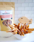 Load image into Gallery viewer, Shrimp treats from Naked Beasts in a white bowl, with a Naked Beasts bag in the background