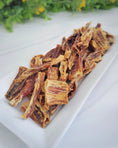 Load image into Gallery viewer, Mahi Mahi jerky strips (wild-caught) by Naked Beasts on a white plate