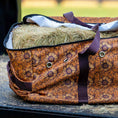 Load image into Gallery viewer, Jeffers Expression Full Hay Bale Tote Bag with orange floral pattern and purple straps, filled with hay.