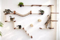 Carica l'immagine nel visualizzatore della galleria, The Juggernaut cat condo by Catastrophic Creations, a wall-mounted cat tree with light wood shelves and beige rope.