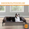Load image into Gallery viewer, K&H Original Bolster Pet Cot elevated dog bed with brown frame and dark cushion, indoors; K&H logo visible.