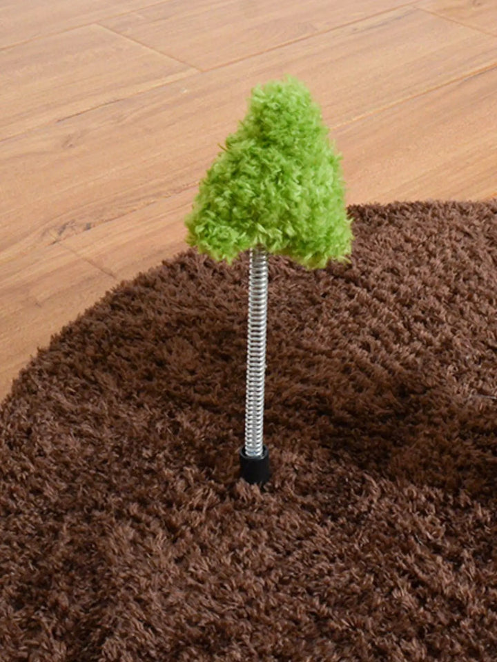 Green tree-shaped toy on a metal spring attached to the brown base of the Solana Sunflower Cat Tree