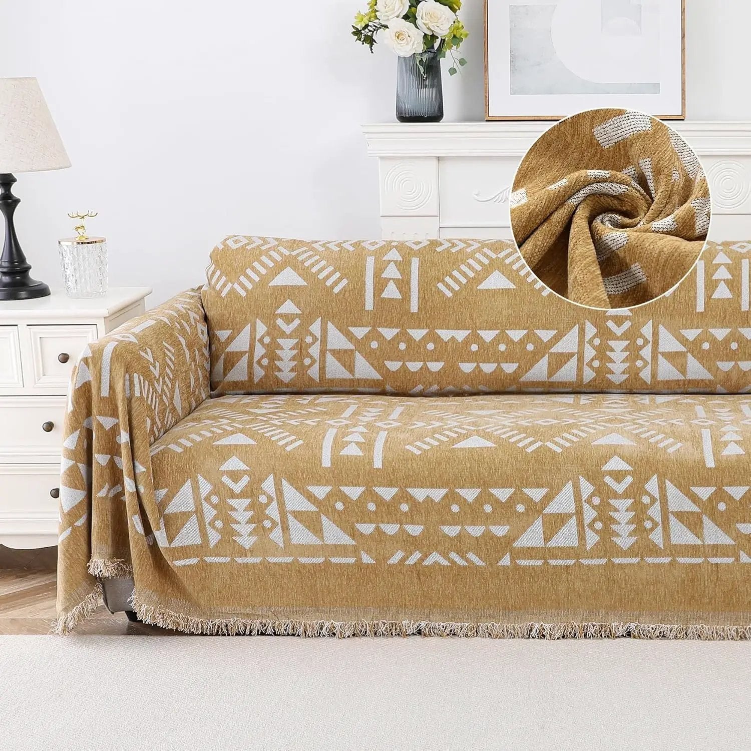 topspet Premium Couch Cover Blanket in tan with white geometric pattern and fringed edges on sofa