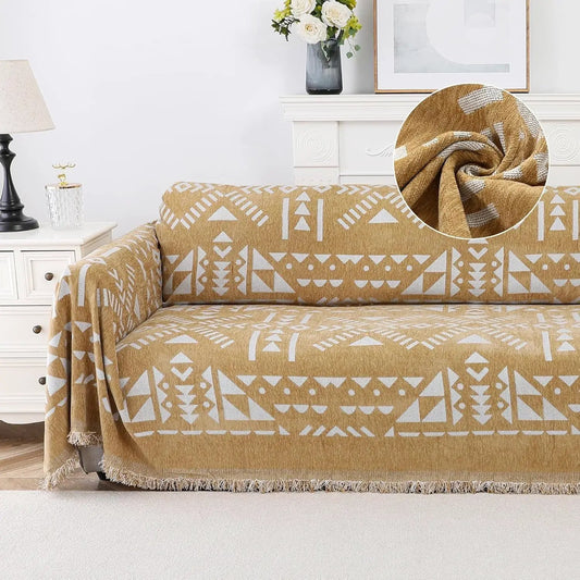 topspet Premium Couch Cover Blanket in tan with white geometric pattern and fringed edges on sofa