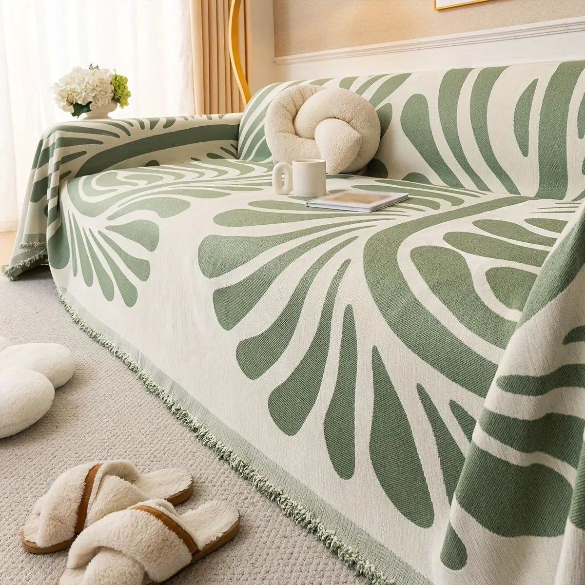 Versatile chenille sofa cover by topspet in green leaf pattern, draped over a sofa, pet-friendly.