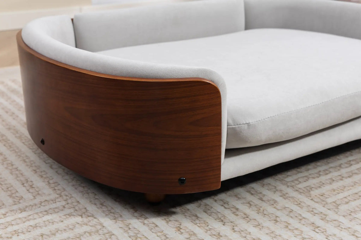 Scandinavian Style Elevated Dog Bed by Home Furnishers with solid wood legs and gray upholstery