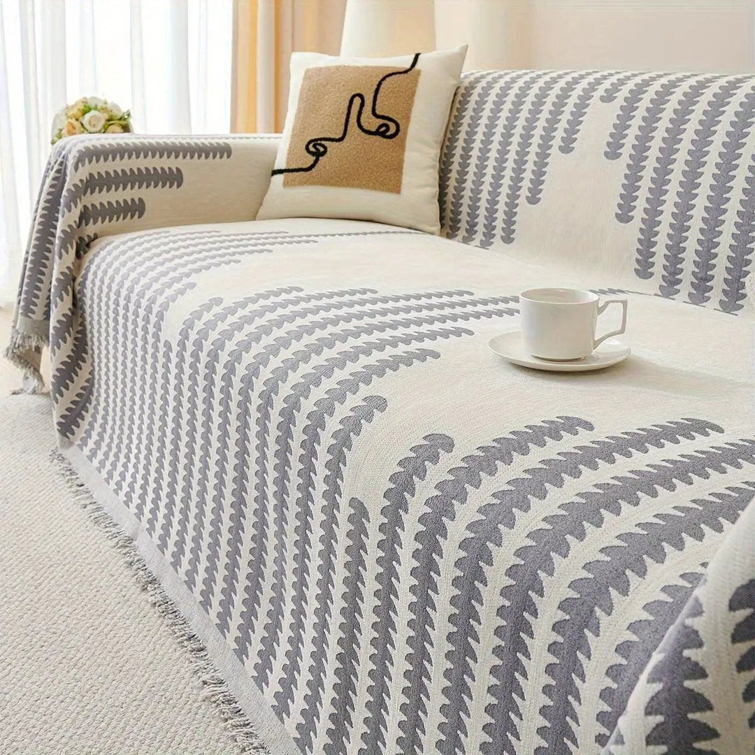 Chenille fabric sofa cover; cream with gray geometric pattern, fringe edges, non-slip universal protector