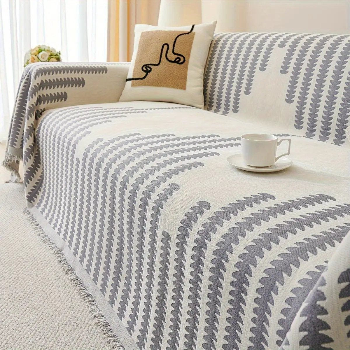 Chenille fabric sofa cover; cream with gray geometric pattern, fringe edges, non-slip universal protector