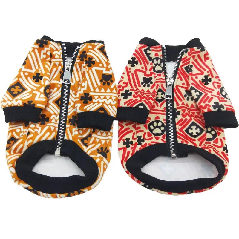 Dog jackets: two teddy-print zip-up coats in orange and red.