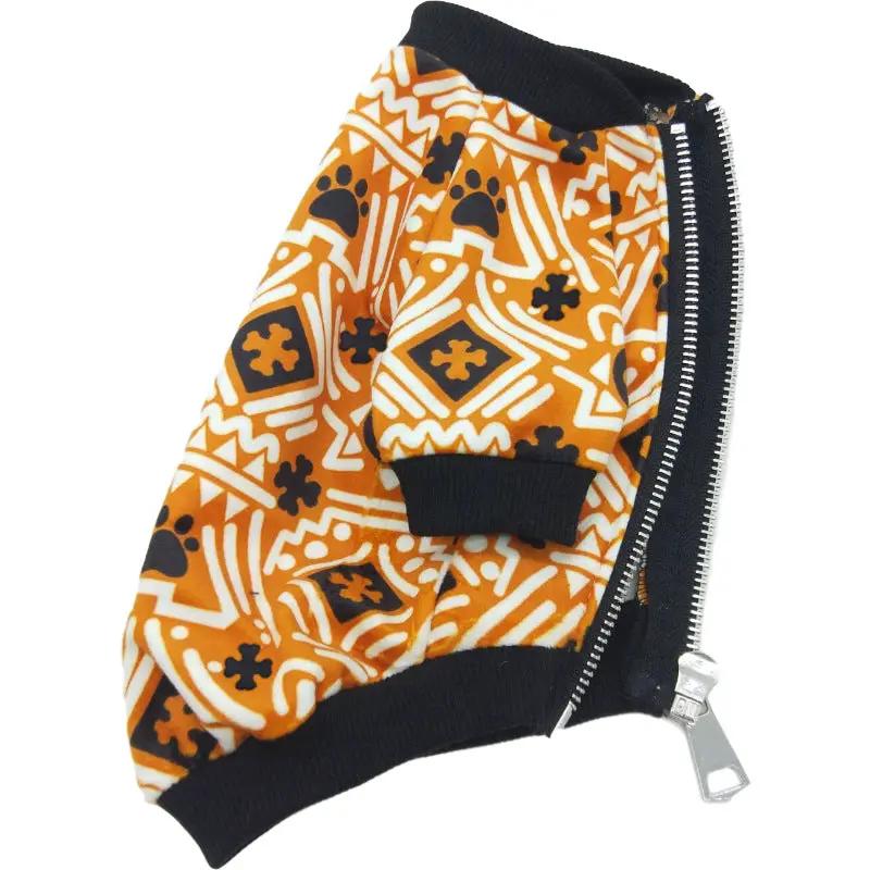 Dog jacket in orange geometric Christmas print, teddy fabric with black rib cuffs and side zipper