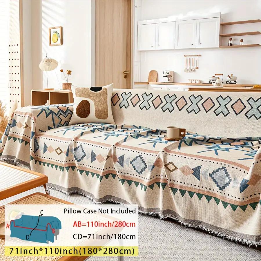 Extra Large Sofa Cover by topspet; stretchable beige furniture protector with blue and brown geometric pattern.