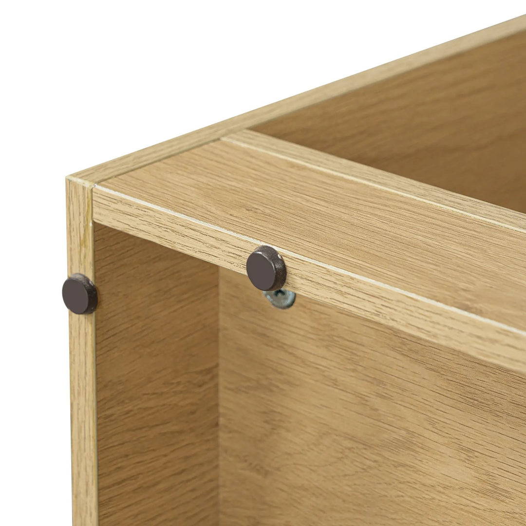 Close-up of round floor pads and corner hardware on the underside of The Curator Cat Bookshelf in Natural