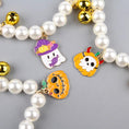 Load image into Gallery viewer, Halloween pet collar with charms featuring colorful ghost, pumpkin, and skull charms with pearl beads and gold bells.

