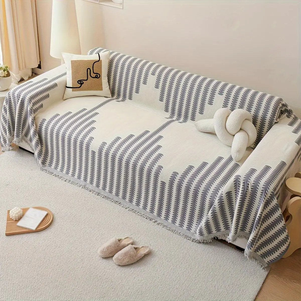 Chenille fabric sofa cover in cream with gray striped pattern and fringe edges; non-slip universal protector