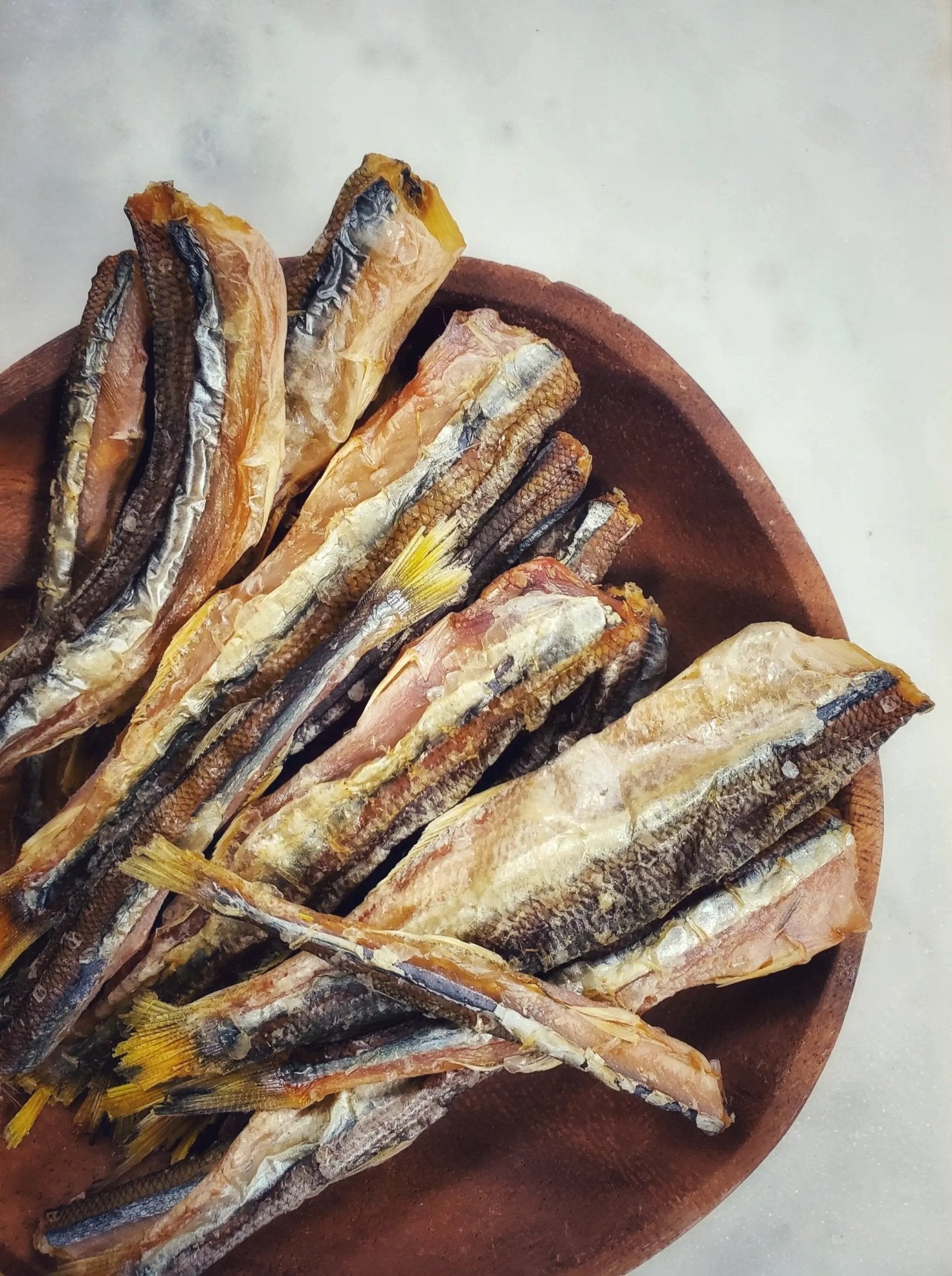 Smelt (Wild Caught) dried fish, Naked Beasts brand, in a brown bowl