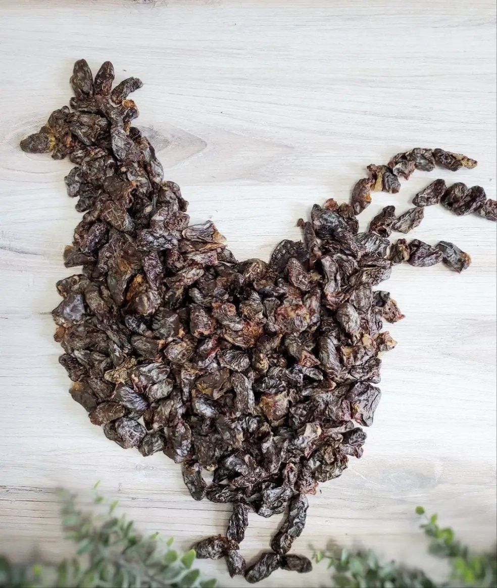 Chicken Hearts by Naked Beasts; small animal treats, dark dried chunks arranged in a heart shape.
