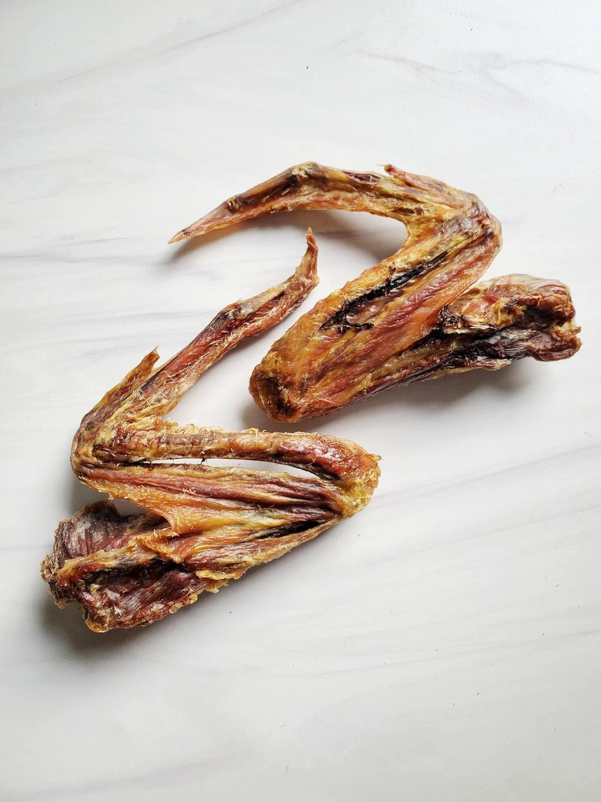 Duck Wings ABF jerky by Naked Beasts, dried brown duck wing pieces