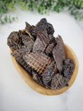 Load image into Gallery viewer, Turkey liver small animal treats by Naked Beasts, dark brown jerky slices in a wooden bowl

