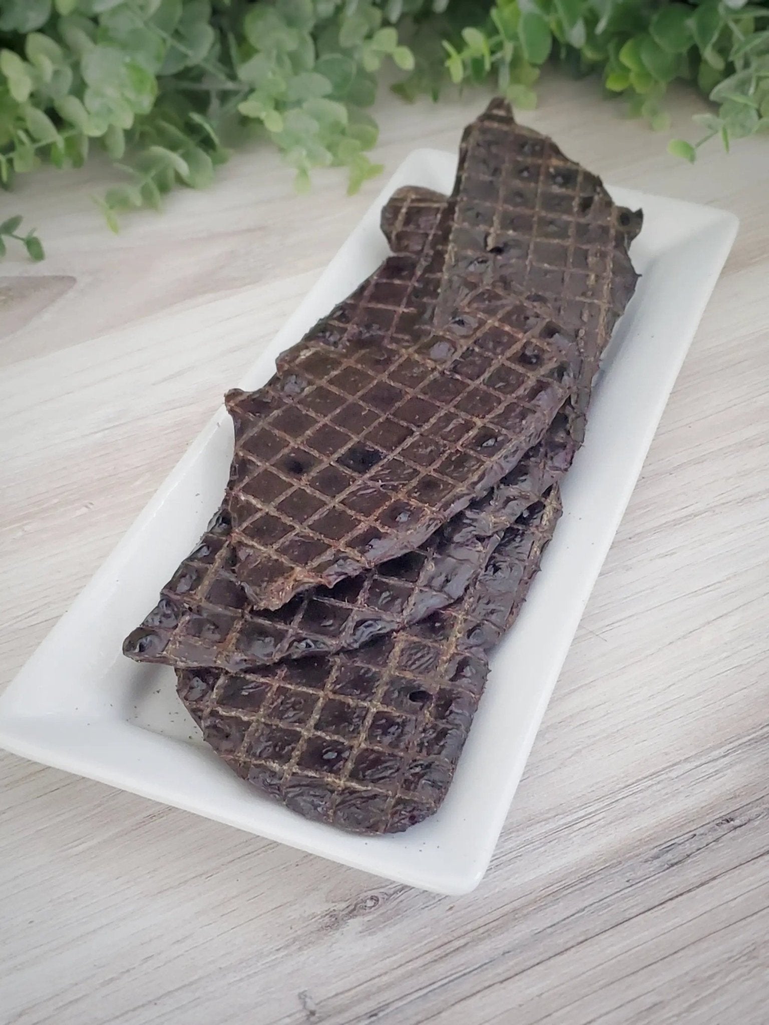 Beef liver thin-cut slices from Naked Beasts on a white tray with grid scoring.