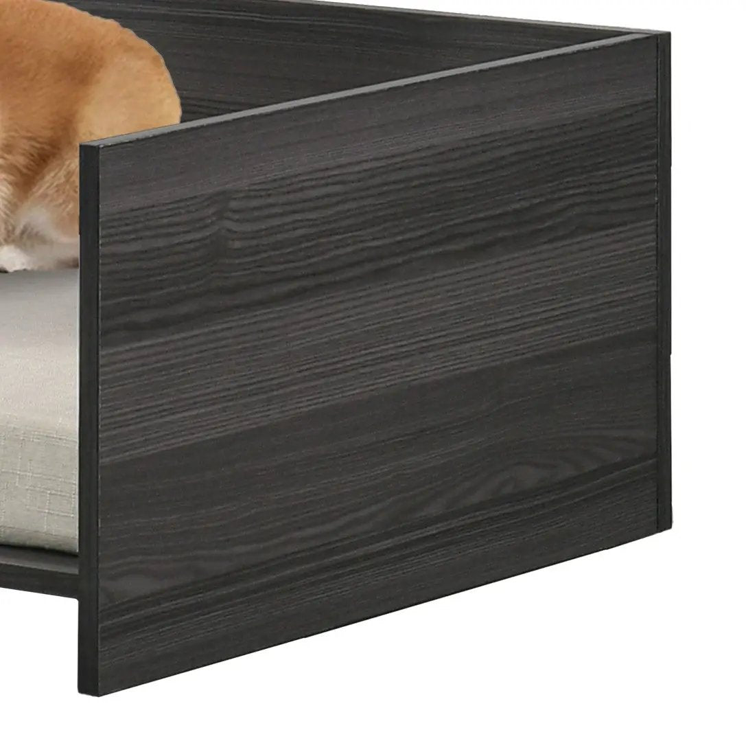 Esme Ash Pet Bed with Side Storage, dark ash wood frame and beige cushion with a dog resting inside