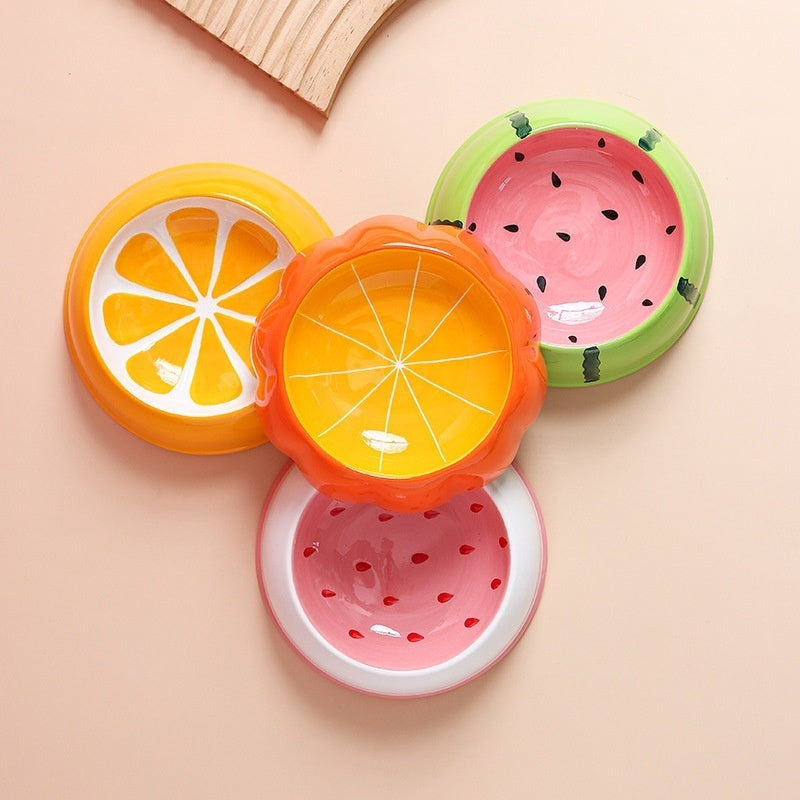 Assortment of fruit and pumpkin ceramic bowls