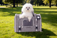 Charger l'image dans la visionneuse de la galerie, Mr. Peanut's Monterey Series airline-compliant horizontal backpack carrier for pets, gray exterior, white dog inside.
