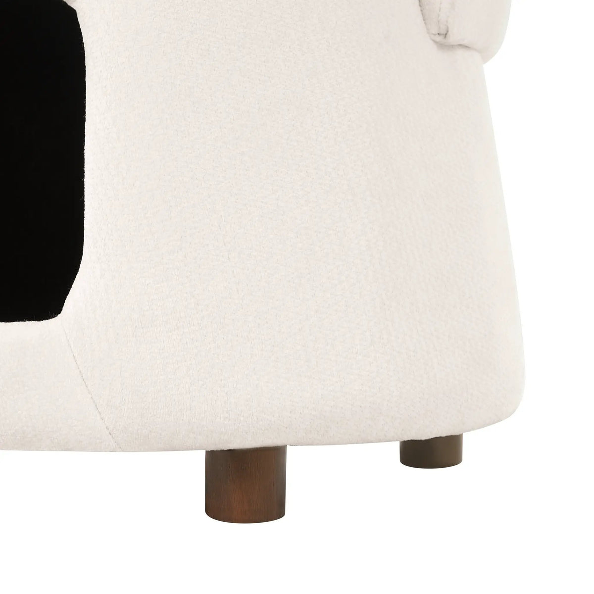 Beige pet-friendly chair with hidden pet nook, fabric upholstery, dark wood legs by Home Furnishers.
