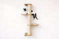 Charger l'image dans la visionneuse de la galerie, Wall-mounted cat climbing pole with sisal wrap and two wooden platforms; black and white cat climbing.
