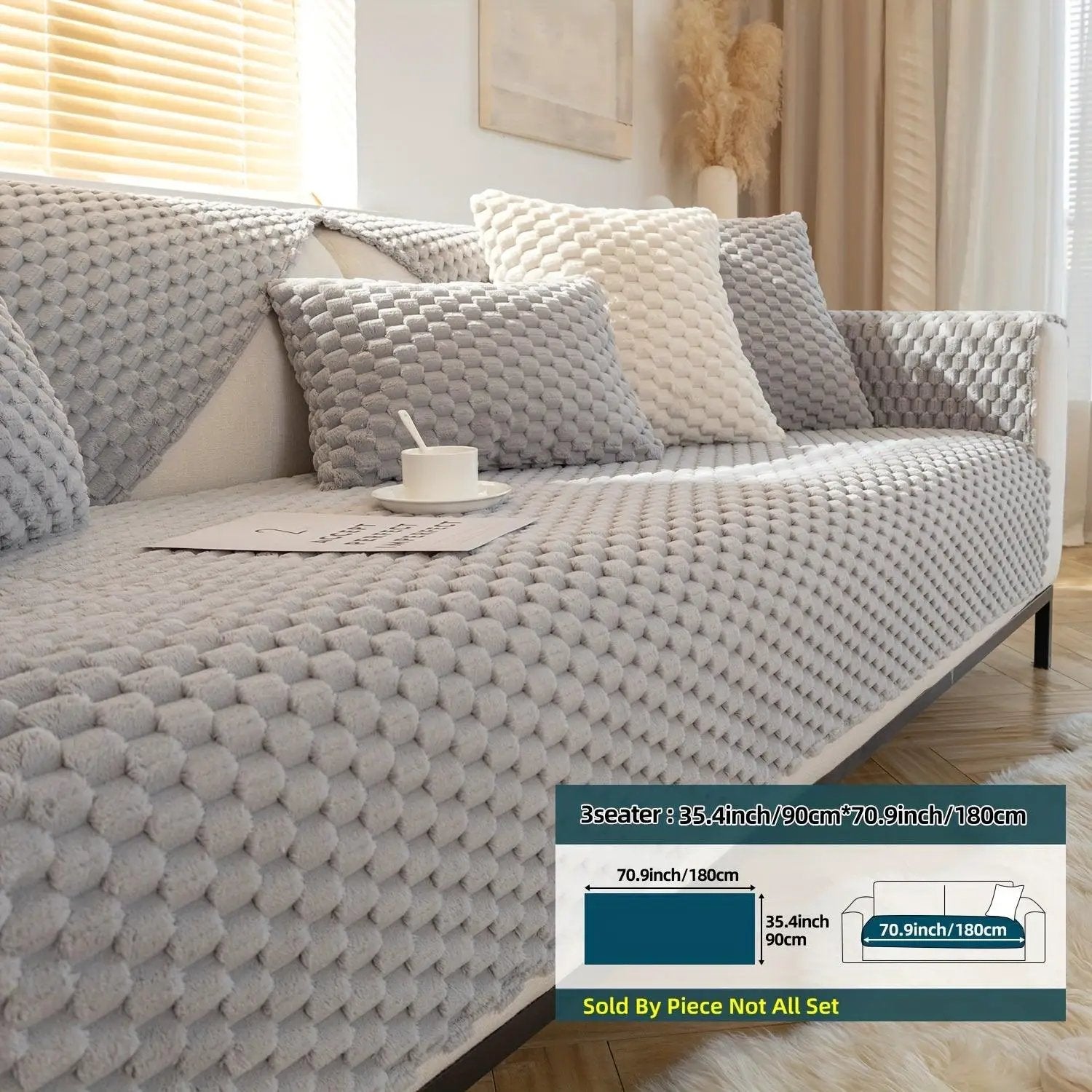 Plush Nordic Sofa Slipcover with gray knitted cushions on a light-gray sofa.