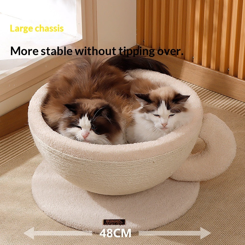 Cream coffee-cup bed on saucer base with cats