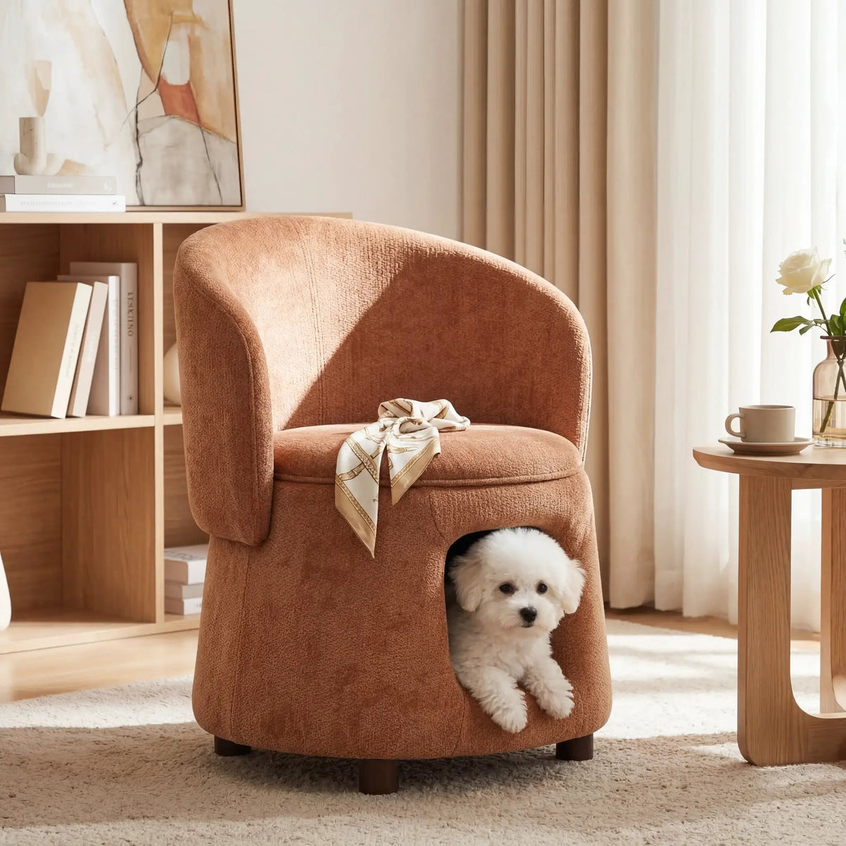 Orange pet-friendly chair with hidden pet nook; small white dog peeks from the lower opening.
